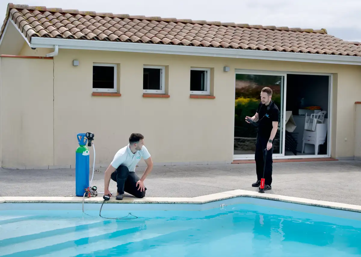 a man next to a pool